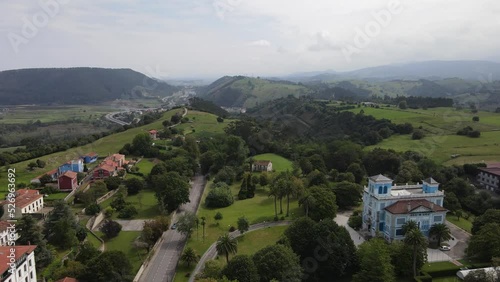 Aerial landscape view of Colombres in Asturias with cars driving near Quinta de Guadalupe photo
