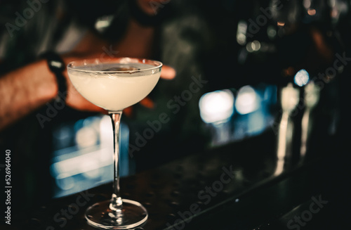 man hand bartender making cocktail in glass on the bar counter