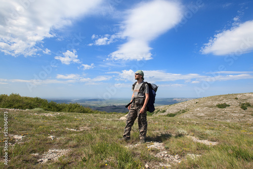 Male backpaker on the crimean hills photo