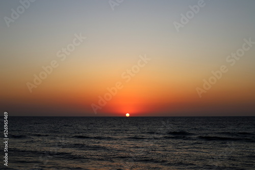 The sun sets below the horizon on the Mediterranean Sea in northern Israel. © shimon