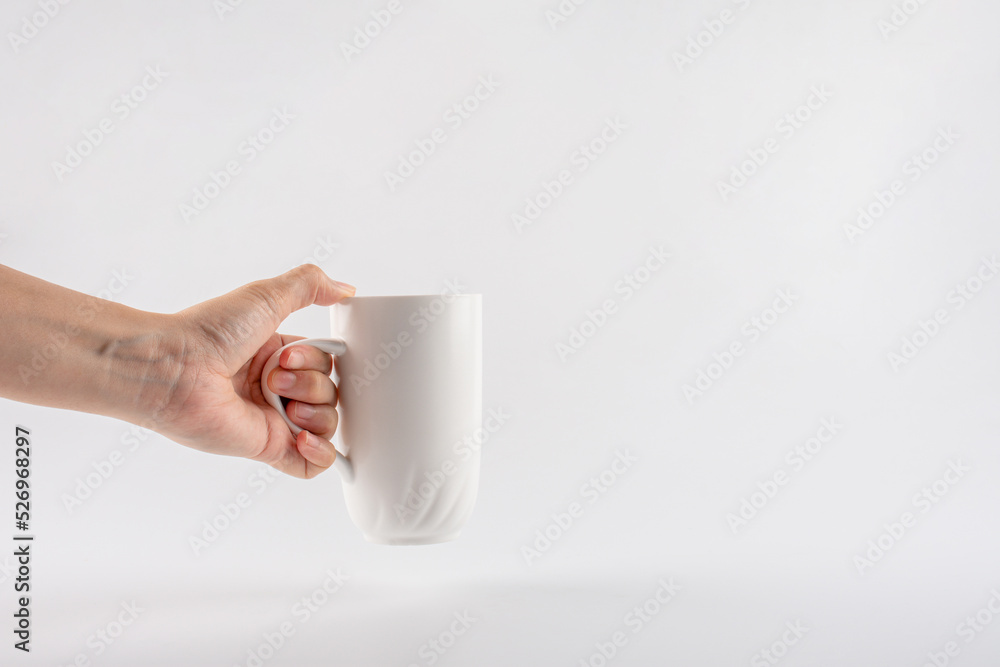 hand and white cup isolated on white background hand and white cup isolated on white background