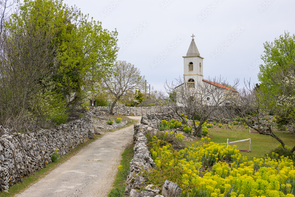 Small church of Predoscica on a cloudy day in spring