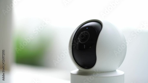 in the living room.
Home security cameras are filming around controlled by a smartphone.
The robot's home security camera scans its surroundings.
A smart home surveillance system that works remotely. photo
