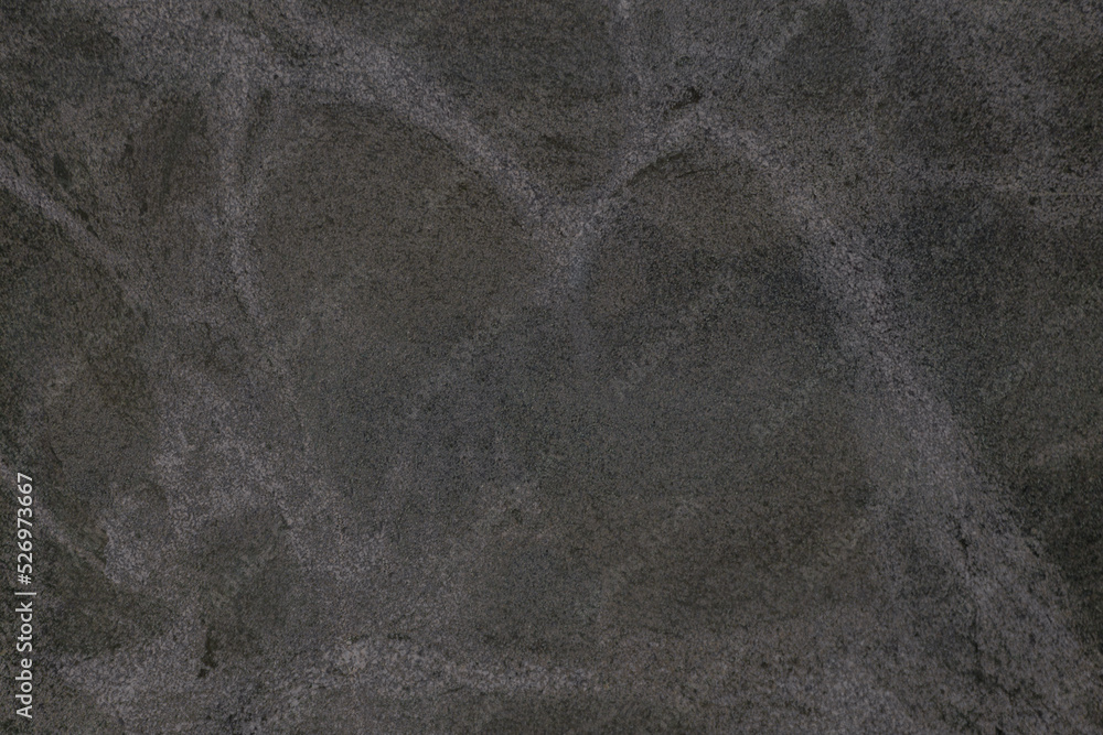 Dark grey stone texture with light gray veins Dark grey stone texture with light gray veins