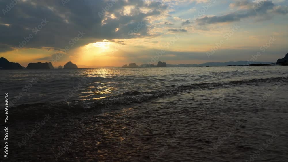 Krabi Island in Thailand. The beautiful natural scenery and the golden light of nature shines down on the sea. Light of hope. Ocean waves crashing on the beach. natural background.4k Krabi Island in Thailand. The beautiful natural scenery and the golden light of nature shines down on the sea. Light of hope. Ocean waves crashing on the beach. natural background.4k