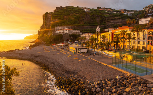 Sunset in Ponta do Sol, Madeira, aerial view of the beach in summer with the sun setting. Portugal