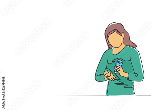 Single one line drawing of a woman pours hand sanitizer into her palms to avoid bacteria and be more hygienic. Self-protection against corona virus. One line draw design graphic vector illustration.