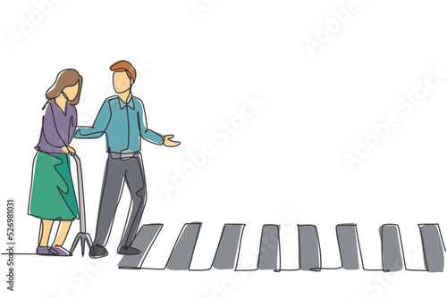 Continuous one line drawing a young man helps an old grandmother who uses a cane to cross the road on the zebra crossing. Good attitude on the road. Single line draw design vector graphic illustration