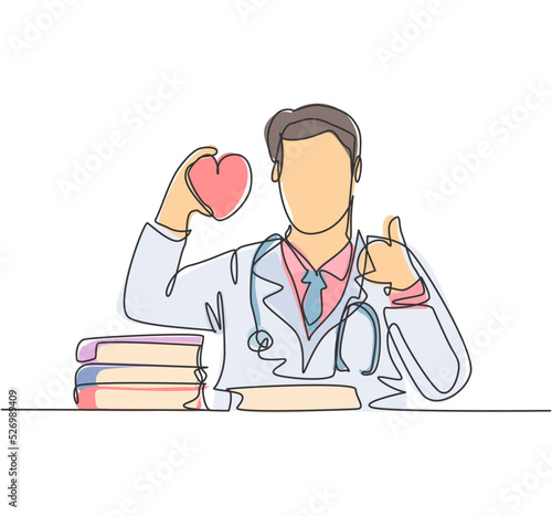 One line drawing of young happy male doctor holding heart replica on his hand and giving thumb up gesture. Healthy lifestyle healthcare concept. Medical continuous line draw design vector illustration