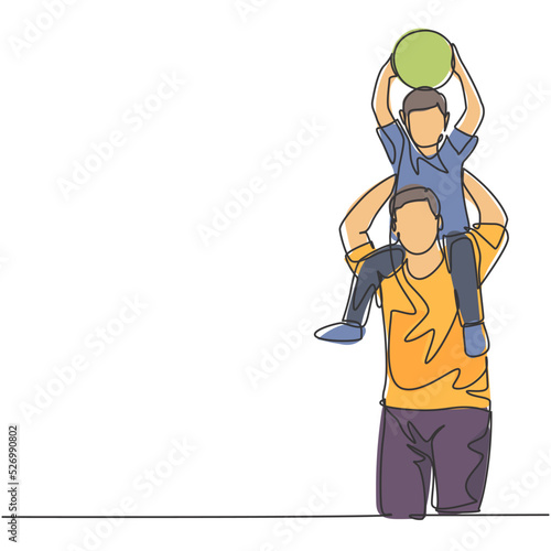 One line drawing of young happy father lift up his son while holding a ball on the shoulder and playing together. Parenting family concept. Continuous line draw design graphic vector illustration