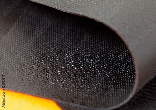Water droplets on the rubber membrane. Waterproofing...  Close-up selective focus area.