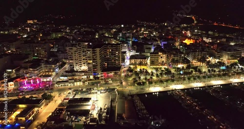 Wallpaper Mural City lights at night, facing the marina. Aerial video of the skyline and the streets full of vehicles. Sant Antoni de portmany, Ibiza. Torontodigital.ca