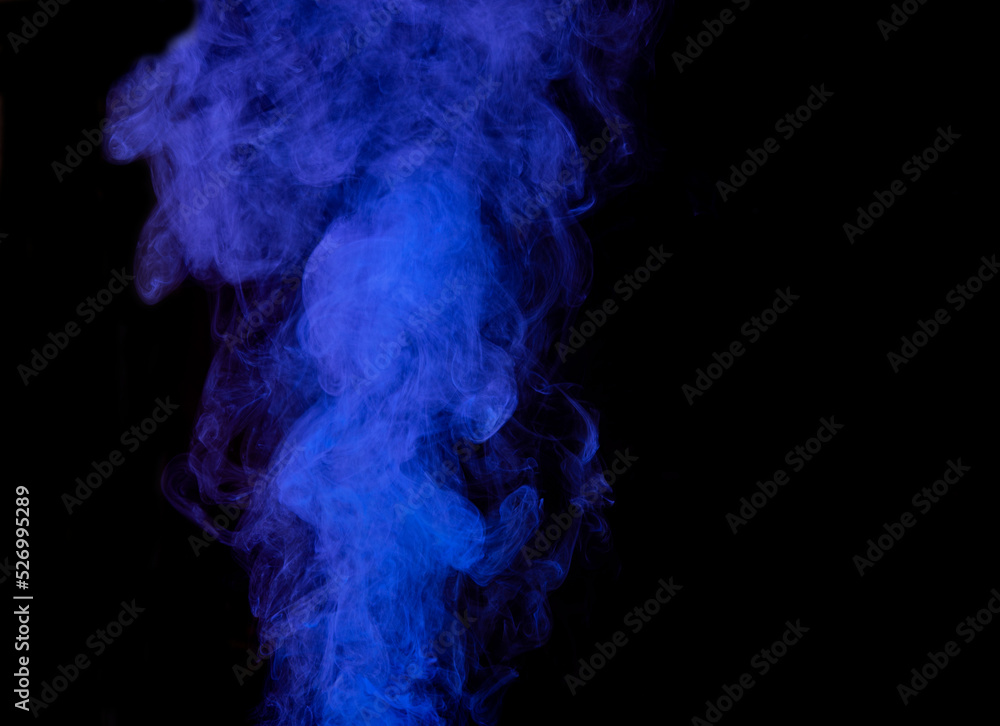 Blue color smoke creating abstract black wallpaper with copy space Blue color smoke creating abstract black wallpaper with copy space