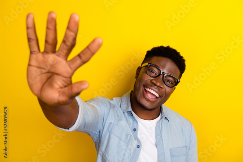 Photo of cheerful guy manager done project partner give high five gesture in camera isolated vivid color background photo
