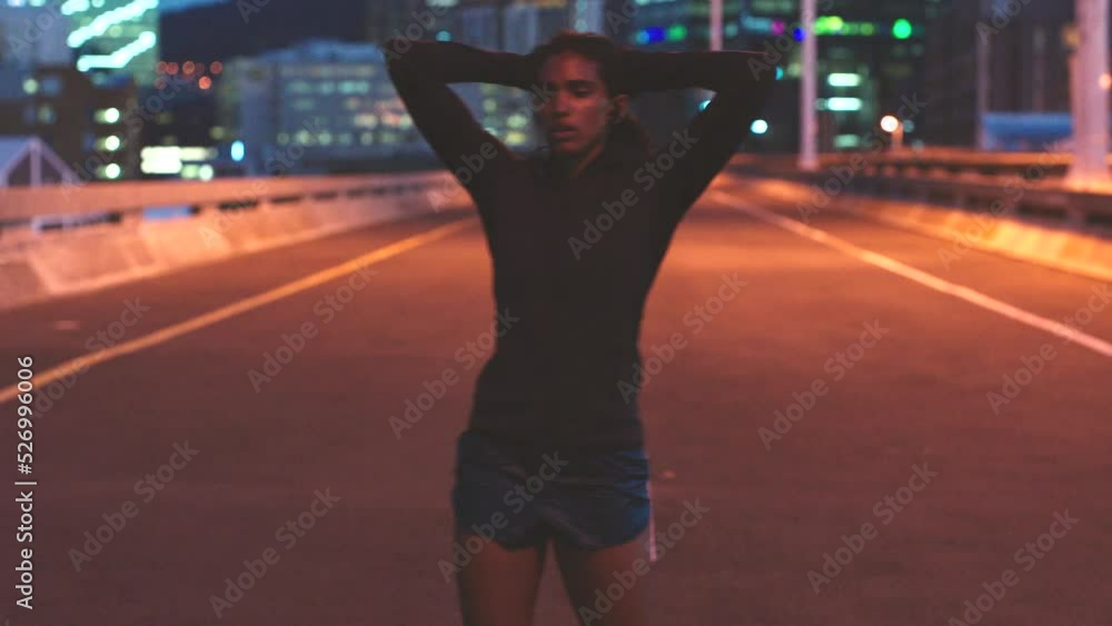 Woman resting, after running in city at night for fitness, health and cardio. Healthy, tired and exercise street runner relaxing after run in the morning or training marathon, sport or workout Woman resting, after running in city at night for fitness, health and cardio. Healthy, tired and exercise street runner relaxing after run in the morning or training marathon, sport or workout