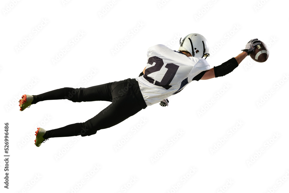 Portrait of american football player in motion, catching ball in a jump isolated over white background. Championship
