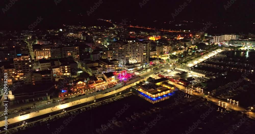 City lights at night, facing the marina. Aerial video of the skyline and the streets full of vehicles. City lights at night, facing the marina. Aerial video of the skyline and the streets full of vehicles.