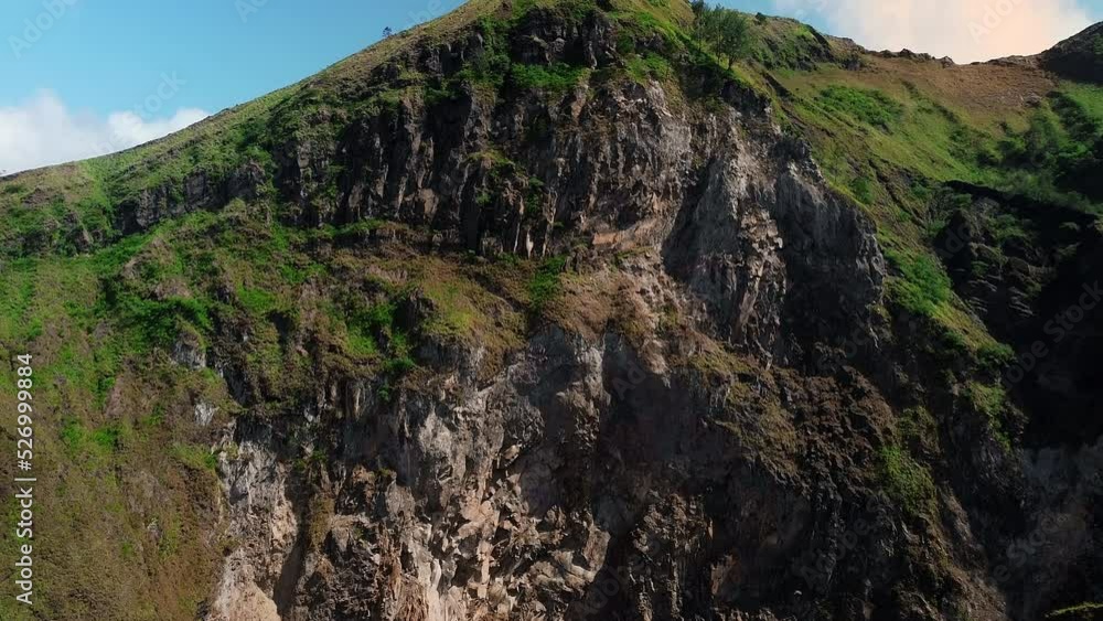 Batur volcano crater on Bali Island. With green forests on the volcano. Drone view. Batur volcano crater on Bali Island. With green forests on the volcano. Drone view.