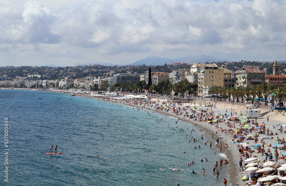View of the Promenade des Anglais and the beaches of Nice at the height of the tourist season in August