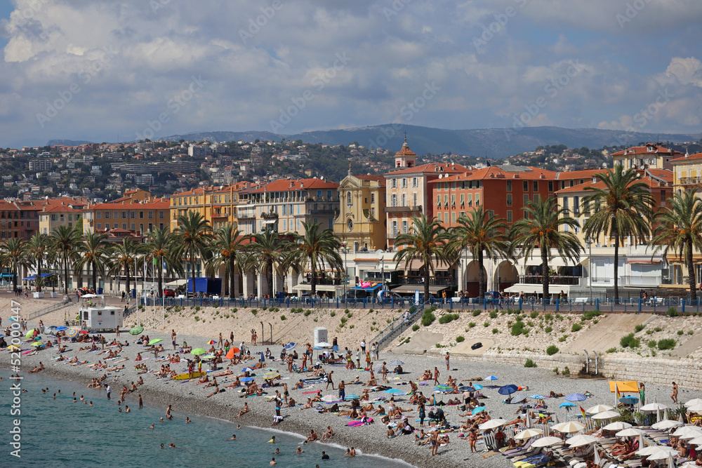 View of the Promenade des Anglais and the beaches of Nice at the height of the tourist season in August View of the Promenade des Anglais and the beaches of Nice at the height of the tourist season in August