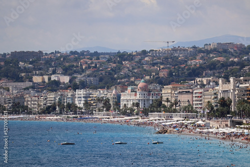 View of the Promenade des Anglais and the beaches of Nice at the height of the tourist season in August