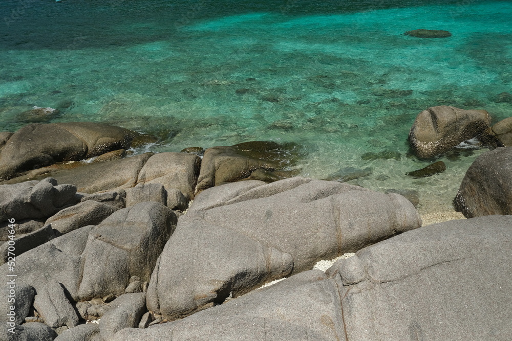 Fototapeta premium Rocks and blue sea during the day ,on the beach,island in Thailand