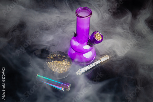 фотографія Purple glass bong with joint and a lot of thick white smoke