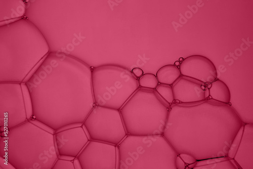 Abstract background of soap bubbles on deep red background