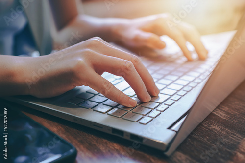 hands typing on keyboard,using laptop for seraching data on internet