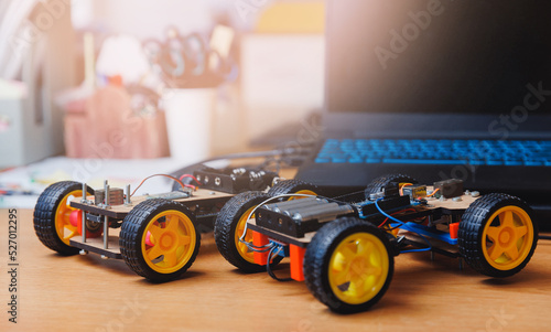 Homemade toy cars with microcontroller for teaching engineers to children photo