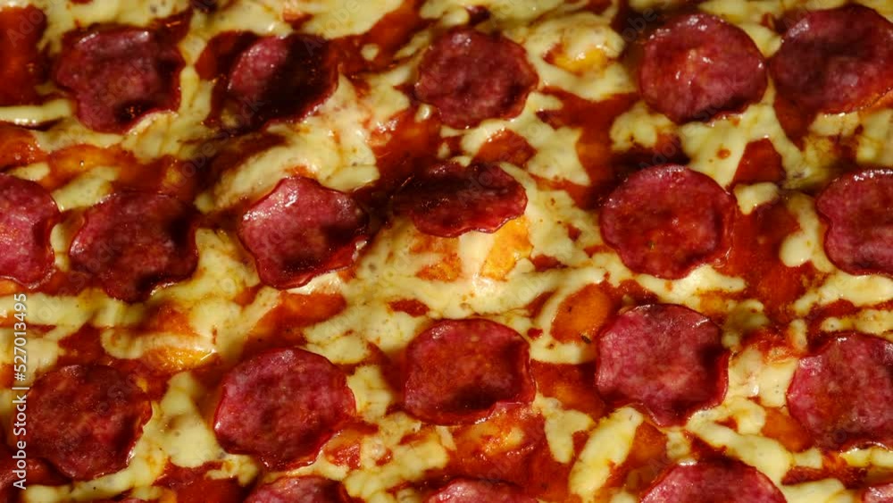 Baking pizza. Baking Pizza with Tomato sauce, sausages and Cheese boiling in an Oven. Traditional Italian Dish Baking pizza. Baking Pizza with Tomato sauce, sausages and Cheese boiling in an Oven. Traditional Italian Dish