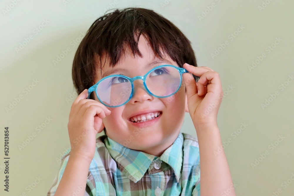 Toddler boy with blue light blocking glasses Toddler boy with blue light blocking glasses