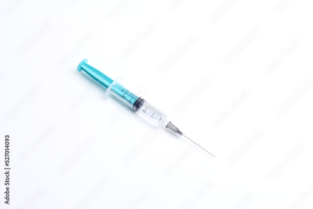 Medical syringe on a white background. A syringe for injection. The concept of health and beauty Medical syringe on a white background. A syringe for injection. The concept of health and beauty