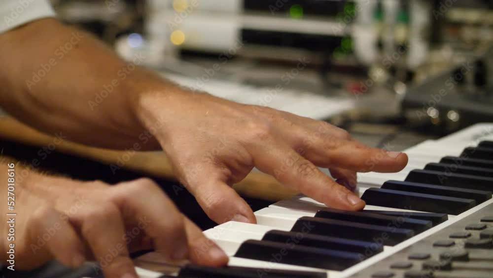 Medium shot of two hands playing electronic keyboard Medium shot of two hands playing electronic keyboard