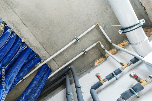Tableau sur toile Pipes of the heating system of a private house in the basement