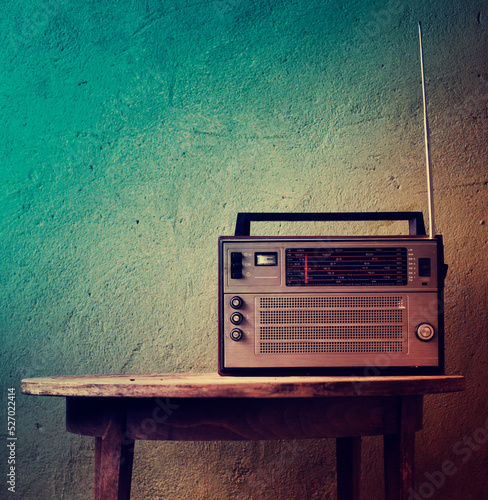 vintage radio over old rustic wooden background