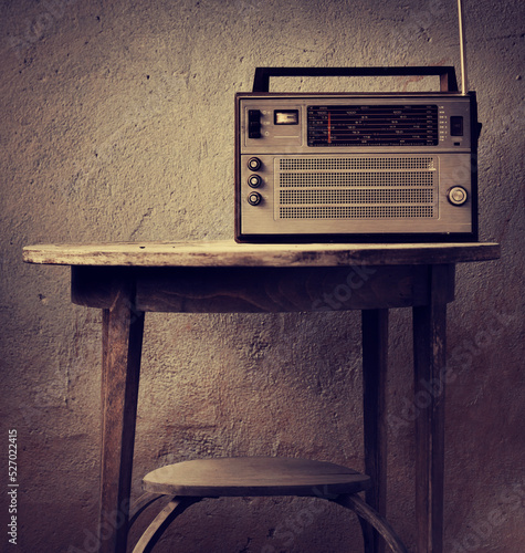 vintage radio over old rustic wooden background