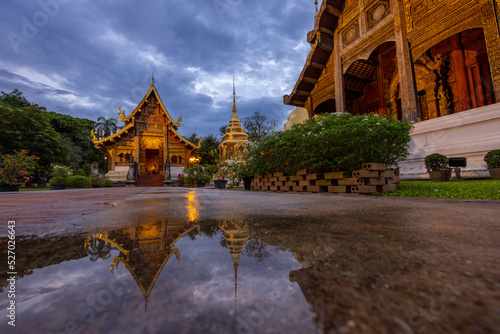 Beautiful Golden Royal Monastery in Thailand and reflections on the water surface 