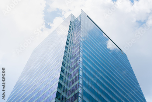 Glass wall architecture building reflection cloud and sky background.concept for modern office
