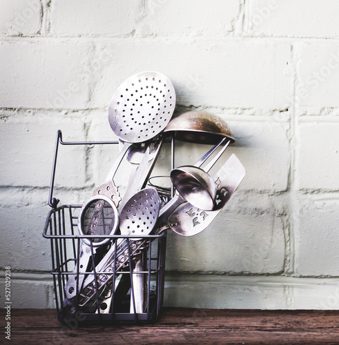 vintage kitchens equipment for cooking over rustic wooden table photo