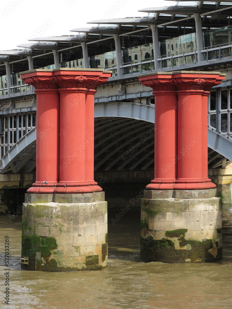 Red columns of an unfinished bridge over the Thames River.
London. United Kingdom. Red columns of an unfinished bridge over the Thames River.
London. United Kingdom.