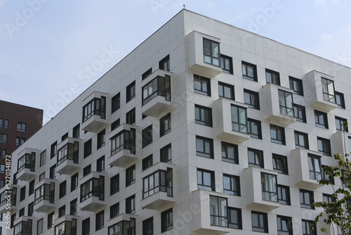 New building facade in housing complex "Green Park. PIK", Moscow city, Russia. Modern style in architecture. Contemporary house in dormitory area. Urban landmark, home. White facade of building