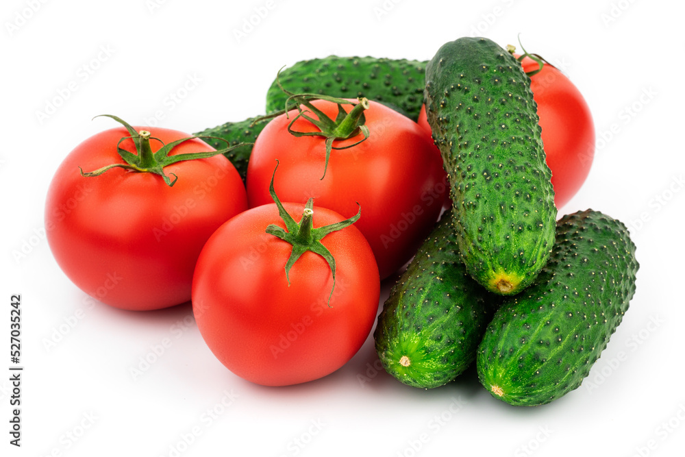 Tomatoes and cucumbers isolated on white background. Fresh vegetables are isolated on white background. Tomatoes and cucumbers isolated on white background. Fresh vegetables are isolated on white background.