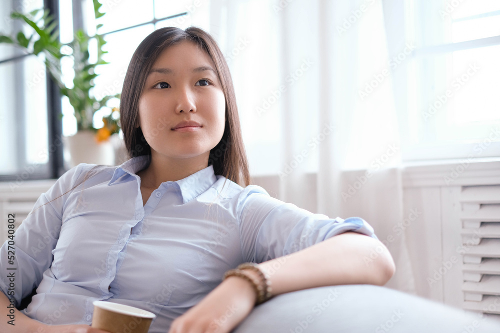 Post-Office Serenity: A Young Asian Woman Captured in Different Poses during a Relaxing Photoshoot