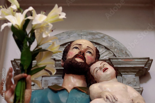 Saint Joseph with sleeping Jesus in Serra San Bruno (Church of the Assumption of Mary) Father's day symbol