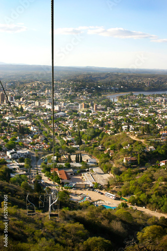 Landscape of the city of Villa Carlos Paz  Cordoba  Argentina. Tourist city of the Valley of Punilla. Latin America. Tourist attraction. View from the Aerosilla hill. Mountains  lakes. Chairlift.