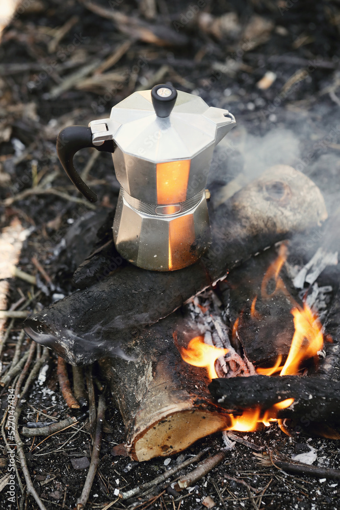 Kettle boil in the fire outside in forest Kettle boil in the fire outside in forest