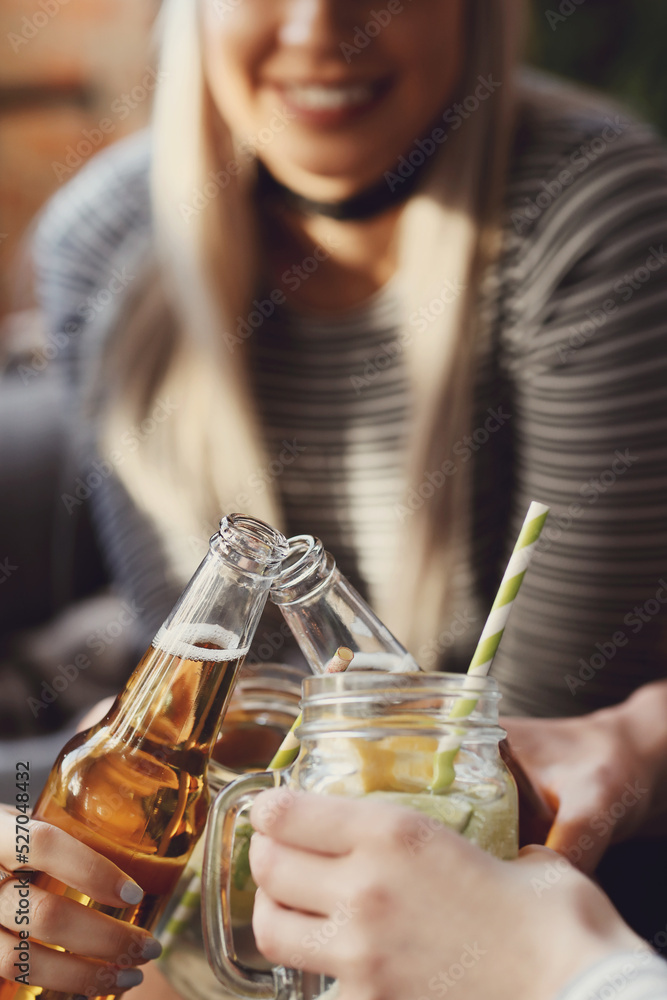 Get the party started with this fun and vibrant stock photo of a group of people enjoying food and drinks in the kitchen Get the party started with this fun and vibrant stock photo of a group of people enjoying food and drinks in the kitchen