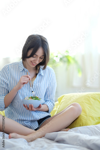 This charming brown-haired model creates a delicious and nutritious breakfast spread in the comfort of her own home, capturing the perfect shot that's ideal for food blogs, lifestyle magazines