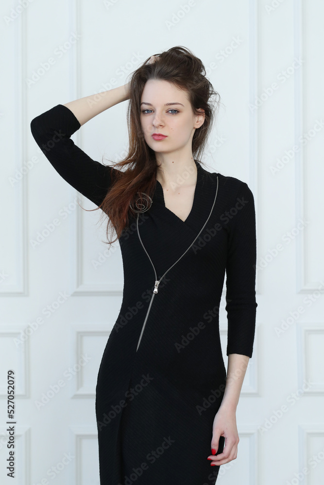 Captivating and elegant, the brown-haired girl in a black long dress exudes grace and poise as she strikes different poses for a stunning studio photoshoot. Captivating and elegant, the brown-haired girl in a black long dress exudes grace and poise as she strikes different poses for a stunning studio photoshoot.
